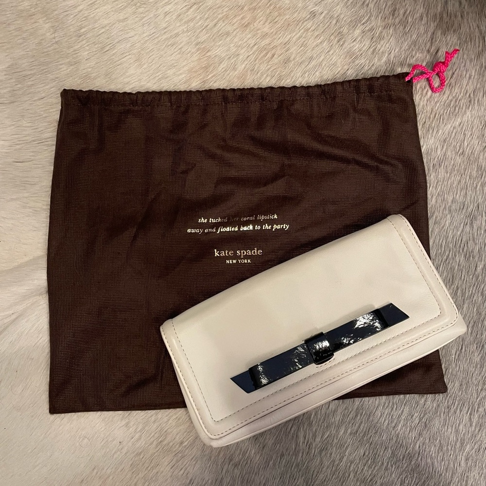 Kate Spade cream clutch with duster